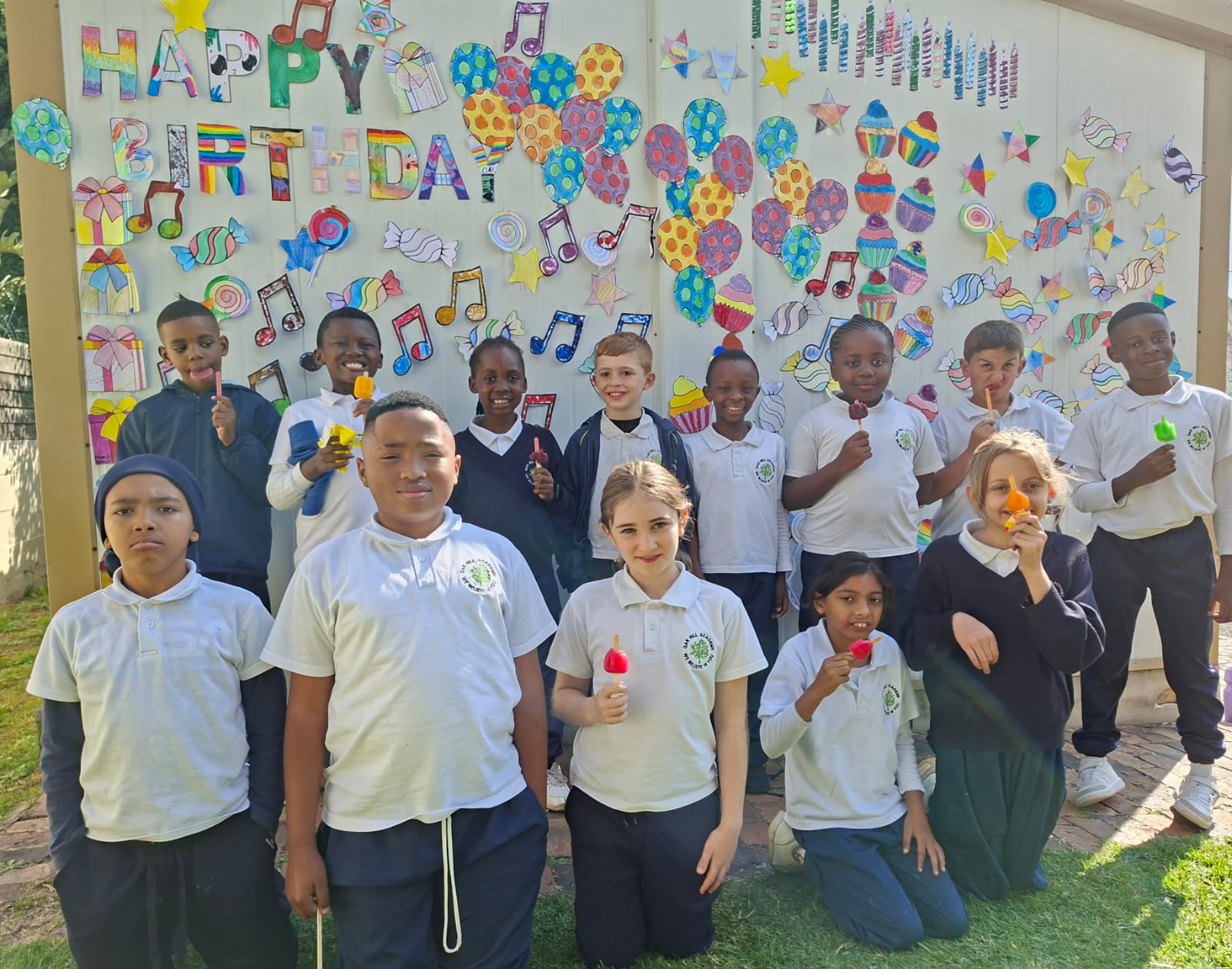 Learners enjoying treats at the 25th birthday celebration